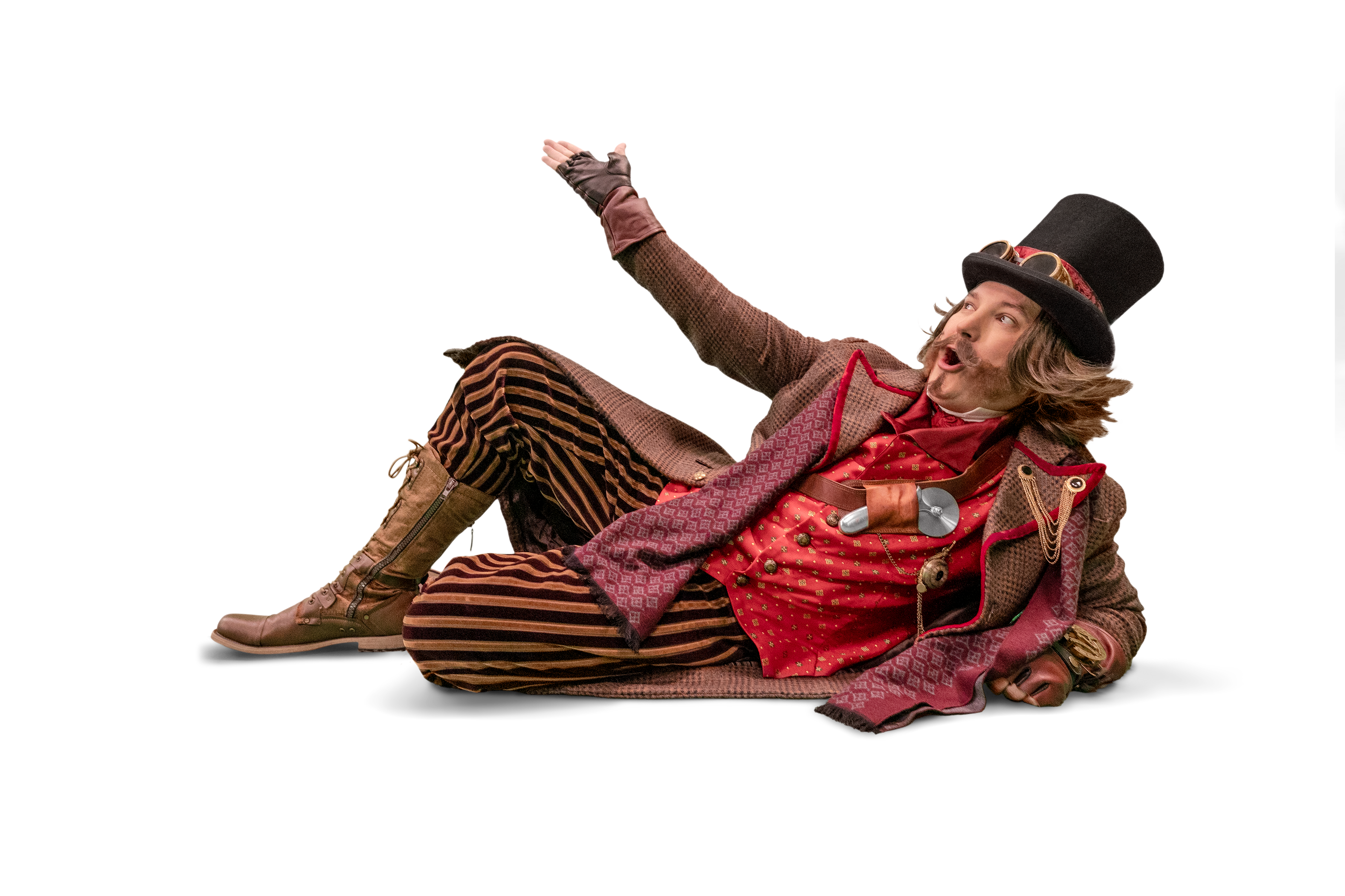 Pazzini reclines dramatically in a Victorian steampunk outfit, wearing a top hat with goggles, a red waistcoat, striped trousers, and boots, while raising one arm against a dark background.