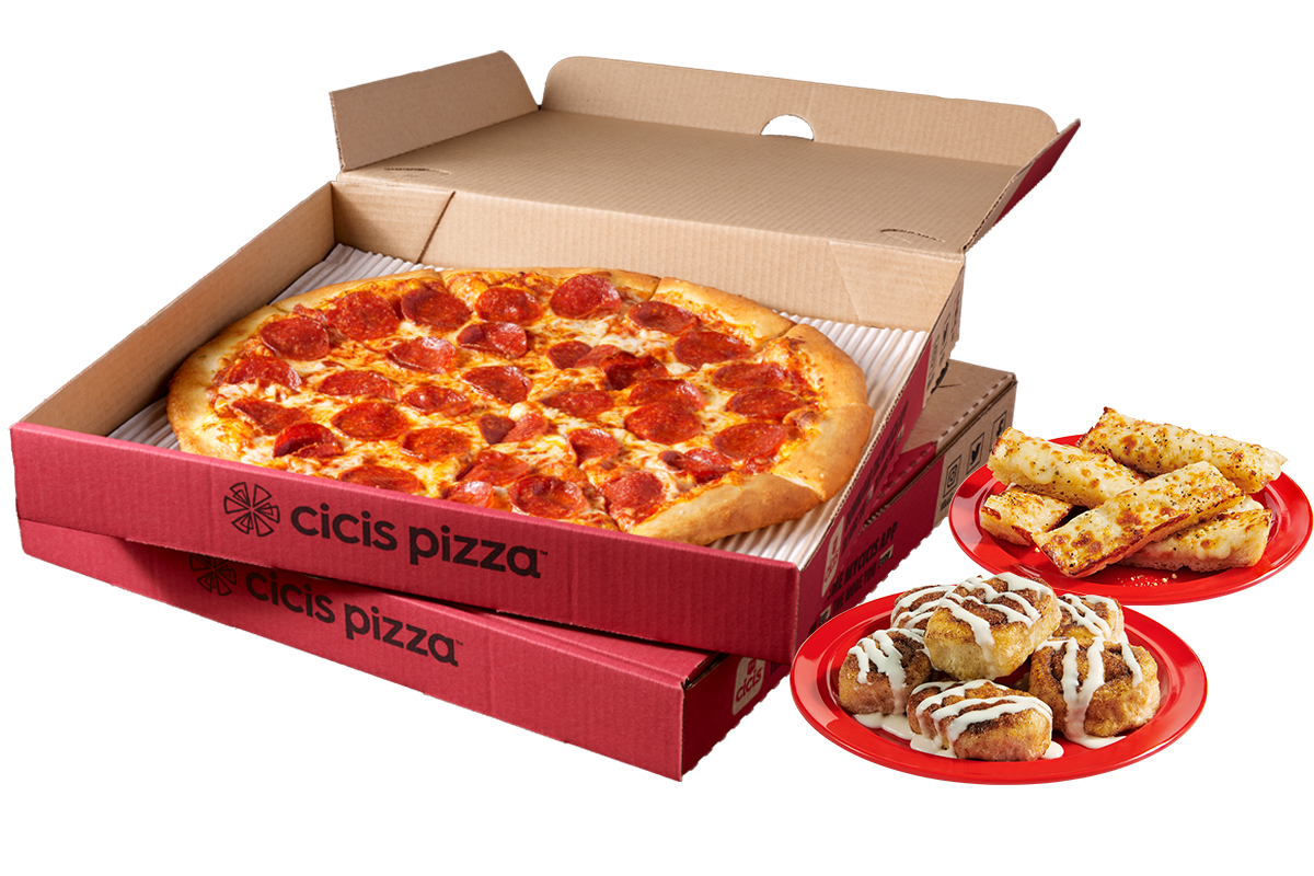 Two stacked pizza boxes with the top box open to show a pepperoni pizza. Next to the pizza boxes are a plate stacked with cinnamon rolls and a plate stacked with garlic cheesy bread.